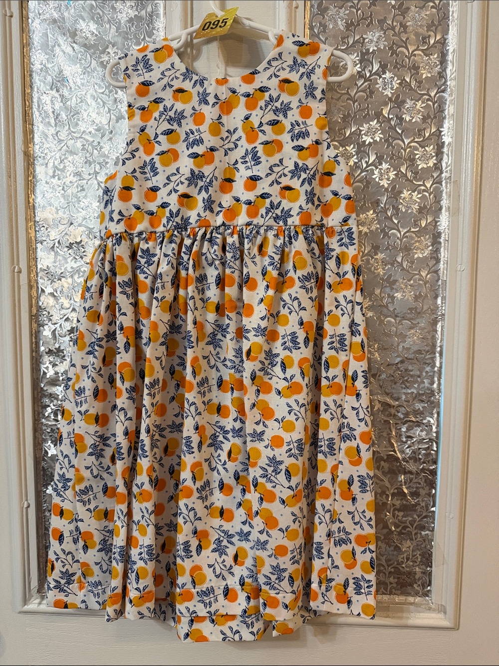 Girls' White Sleeveless Dress with Orange Fruit Print